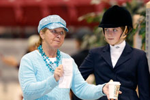 photo of equestrian coach and rider