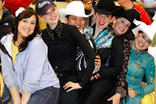 photo of western equestrian riders having fun